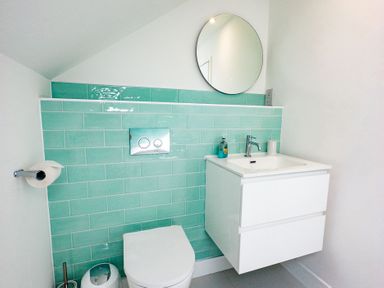 A bathroom with a sink and toilet at Lanesend in St Agnes