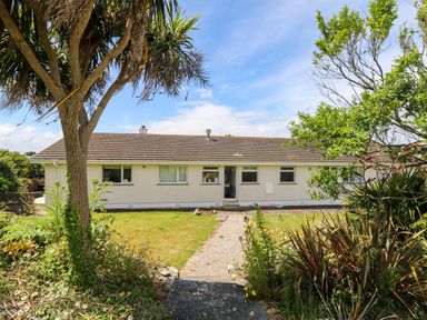 A house with a pathway and garden at Seaport Lodge in Mawgan Porth