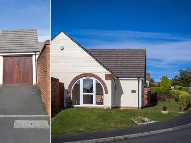 A bungalow with a sloped roof garage and arched window next to a garden with trimmed bushes at Fairways Woolacombe