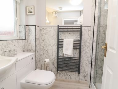 A bathroom with a sink and toilet at Fairways in Woolacombe