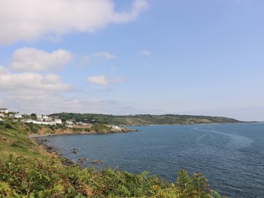A coastal view with houses on cliffs overlooking the sea at Gannet Watch in Coverack