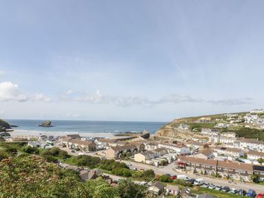 A coastal village with houses near a beach and sea at Trevean in Portreath