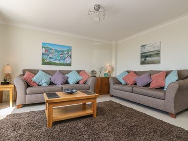 A living room with two sofas and a wooden coffee table at Hagar Vor in Marazion