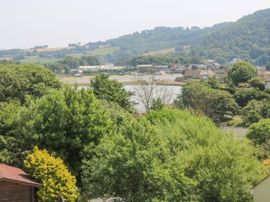 A landscape with trees water houses and hills at Lake View in Kingsand and Cawsand