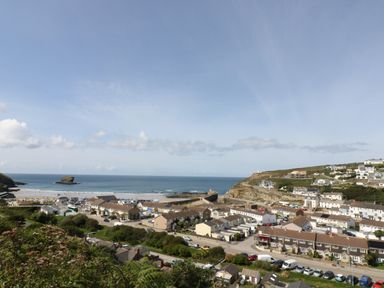 A coastal town with houses and a beach overlooking the sea at Trevoole Barn in Praze An Beeble