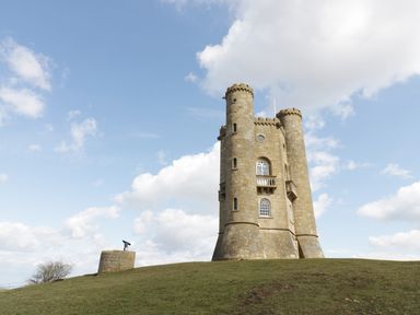A stone tower with crenellated tops on a grassy hill with a telescope on a stone pedestal at Blenheim Edge The Causeway Woodstock