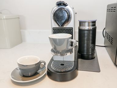 A coffee machine with cups and a milk frother at Crane Field Laithe, Otterburn, North Yorkshire