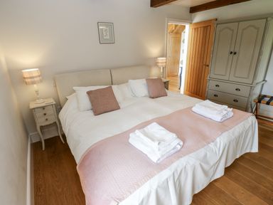 A bedroom with a double bed and bedside table at Crane Field Laithe Otterburn, North Yorkshire