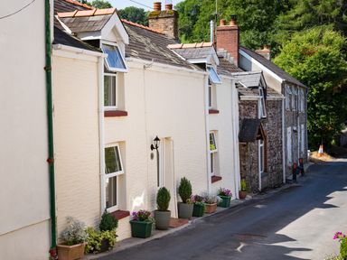A street with houses having flower pots outside at 3 Horse Pool Road in Laugharne