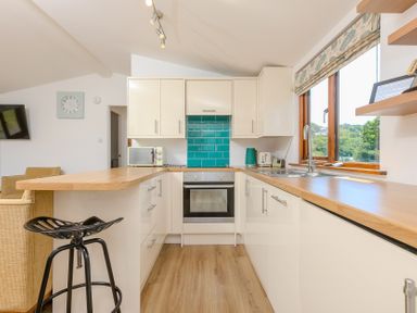 A kitchen with modern appliances at Costentyn, Tor Down Quarry St Breward