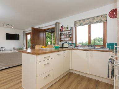 A kitchen with a sink and counter at Tressa, Tor Down Quarry St Breward