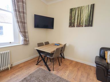 A dining room with a table and chairs at St Johns View in Keswick