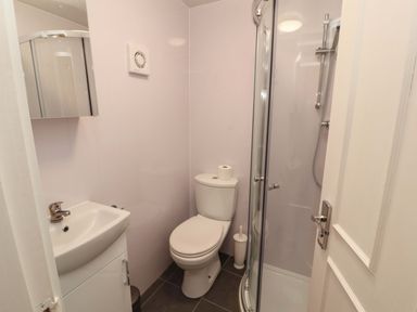 A bathroom with a shower and sink at Archers in Keswick
