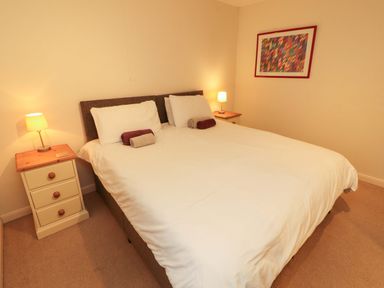 A bedroom with a double bed and nightstands at Archers in Keswick