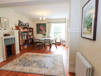 A dining room with a table and chairs at Little Ellers Portinscale near Keswick
