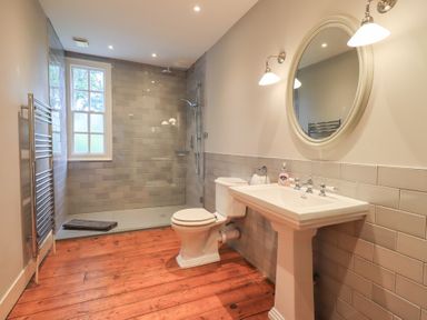 A bathroom with a shower and sink at Little Ellers Portinscale near Keswick