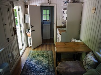 A kitchen with a table and chairs at The Snug in Longtown