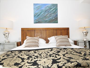 A bedroom with a bed and lamp at The View in Newquay