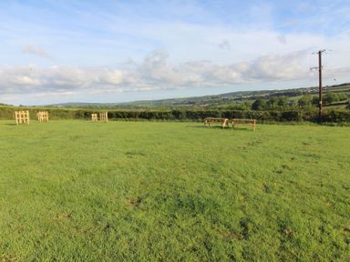 An open space with benches and a view at Hazel Lodge in Lanivet near Bodmin