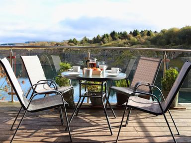 A table with coffee and croissants on a deck at Boavista in Carnforth