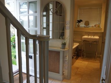 A bathroom featuring a sink and toilet at Coach House Cottage in Strete, near Dartmouth