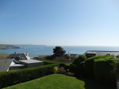 A coastal view with houses garden and ocean at 3 Tarifa in Bigbury-on-Sea