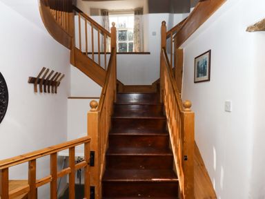 A staircase leading to an upper level at Oak Tree in Halwell