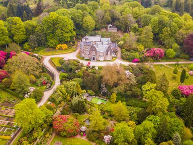 An aerial view of a house surrounded by gardens at The Clock House in Ivybridge