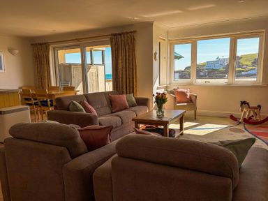 A living room with a sofa and table at 5 Burgh Island Causeway in Bigbury-on-Sea