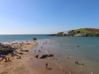 A beach scene with people enjoying the water at 27 Burgh Island Causeway Bigbury-on-Sea