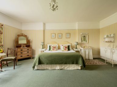 A bedroom with a bed and dresser at Parnacott in Holsworthy