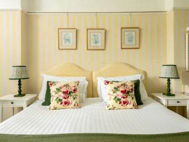 A bedroom with a bed and bedside tables at Parnacott in Holsworthy