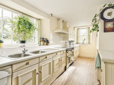 A kitchen with a sink and stove at Parnacott in Holsworthy