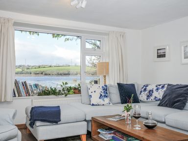 A living room with a sofa and coffee table at Clamoak Cottage Clamoak near Bere Alston