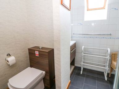 A bathroom with a toilet and sink at Old Farmhouse Cottage