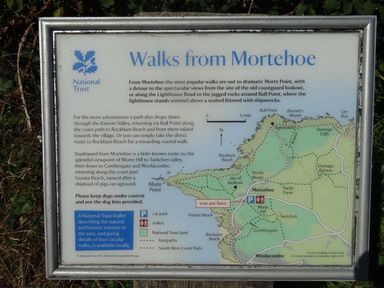 An information board showing walks from Mortehoe with a map and text at Seal Cottage in Mortehoe