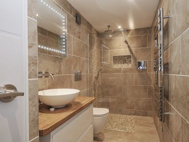 A bathroom with shower and basin at Beach Retreat in Looe