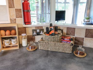 Kitchen countertop with eggs, milk, cups, and a fire extinguisher at 16 Badgers Retreat in Richmond