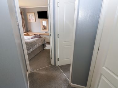 A bedroom view showing a bed and a mirror at 16 Badgers Retreat in Richmond