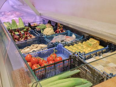A grocery display with vegetables and dairy products at The Cabin at East Hill Pride Four Elms Hill Nr. Sidmouth