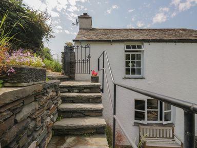 Steps leading to a gated entrance at Rose Cottage in Broughton-In-Furness
