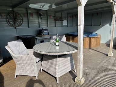 An outdoor space with a table and chairs at Shepherds Cabin at Titterstone Clee Hill