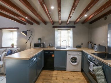 A kitchen with appliances and sink at Cegin Foch in Chwilog