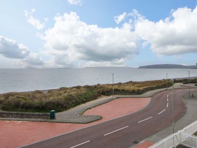 A view of the sea and road at Welymora in Pwllheli