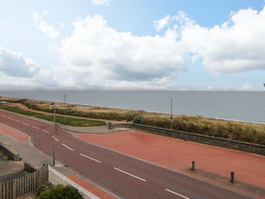 A view of the sea and sky from a road near the beach at Welymora Pwllheli