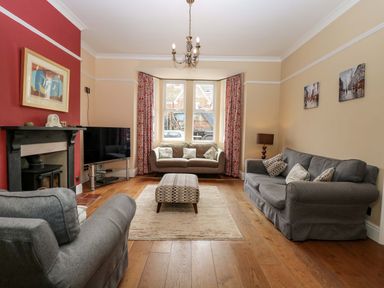 A living room with a sofa and coffee table at Tilly's Retreat in Hunstanton