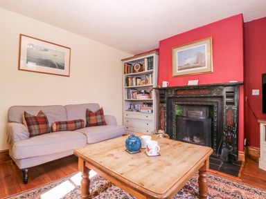 A living room with a sofa and a coffee table at Elm View Chipping Campden