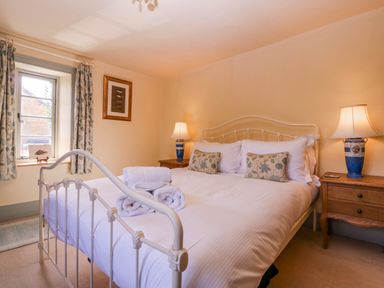 A bedroom with a double bed and bedside tables at Elm View Chipping Campden