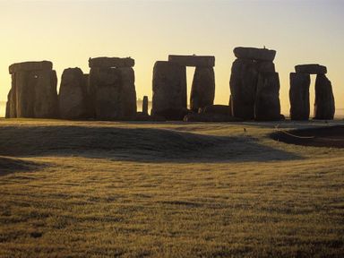 A landscape with large standing stones arranged in a circle at Bridge Studio in Broad Chalke