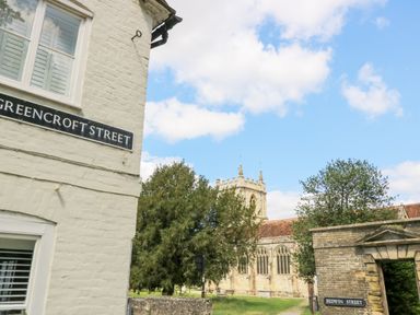 A view of street signs and a church at Rojoy in Salisbury